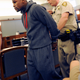 Mayweather Jr. is lead away in handcuffs at the Clark County Regional Justice Center as he surrenders to serve his three-month jail sentence in Las Vegas, Nevada.